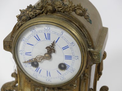 Lot 44 - A 20th century brass mantel clock, the...