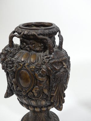Lot 46 - A pair of bronze urns, each decorated with...