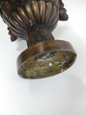 Lot 46 - A pair of bronze urns, each decorated with...