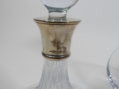 Lot 54 - Two silver collared glass decanters, one of...