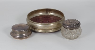 Lot 303 - A modern silver wine coaster, together with a...