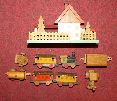 Lot 1514 - A wooden children's train station & loco set