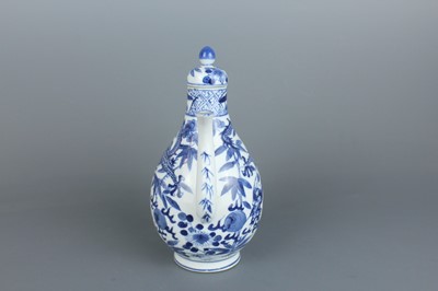 Lot 2 - A Chinese blue and white “dragon” ewer, Qing...