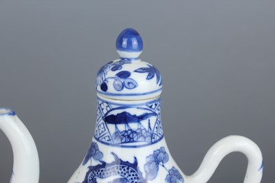 Lot 2 - A Chinese blue and white “dragon” ewer, Qing...