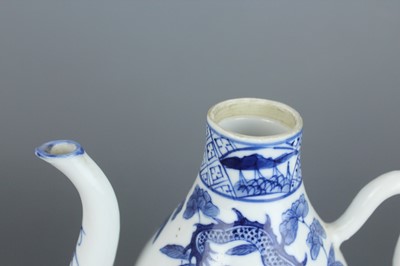 Lot 2 - A Chinese blue and white “dragon” ewer, Qing...