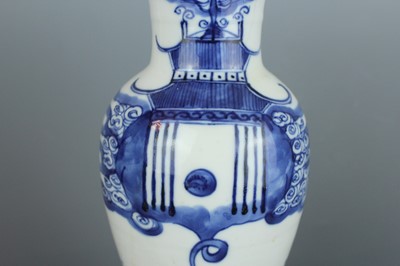 Lot 6 - A Chinese blue and white “fish” baluster vase,...