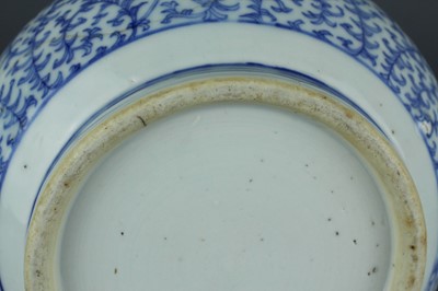 Lot 7 - A Chinese blue and white “scrolling peony”...
