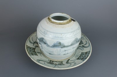Lot 23 - A Chinese blue and white jar with a matching...
