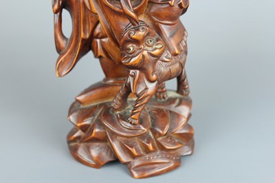 Lot 34 - A Chinese hardwood carving of an immortal...
