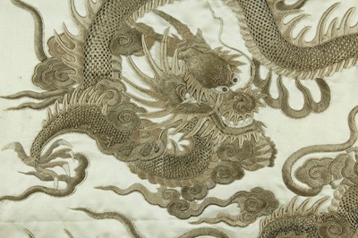 Lot 45 - An imposing embroidered “dragon” silk panel in...