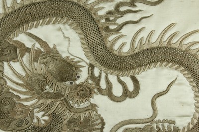 Lot 45 - An imposing embroidered “dragon” silk panel in...