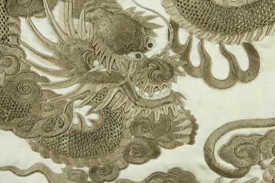 Lot 45 - An imposing embroidered “dragon” silk panel in...