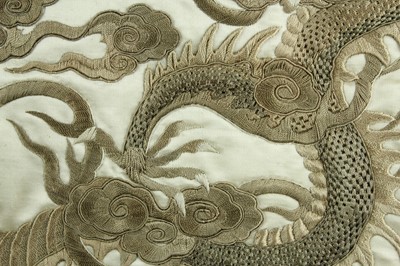 Lot 45 - An imposing embroidered “dragon” silk panel in...