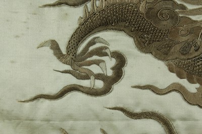 Lot 45 - An imposing embroidered “dragon” silk panel in...