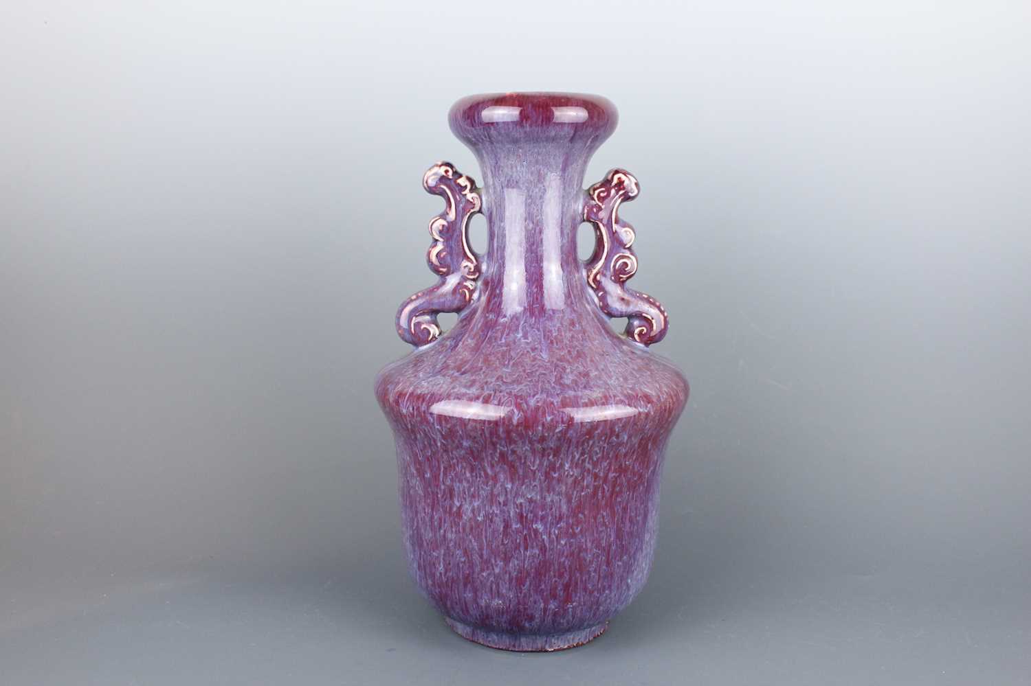 Lot 58 - A Chinese flambé-glazed vase with two handles,...