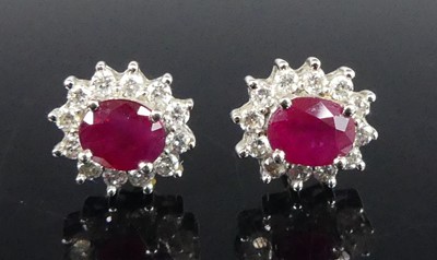 Lot 2902 - A pair of 18ct yellow and white gold, ruby and...