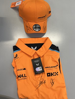Lot 25 - Lot 25 
McLaren F1 Cap & Shirt signed by Lando...