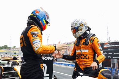 Lot 25 - Lot 25 
McLaren F1 Cap & Shirt signed by Lando...