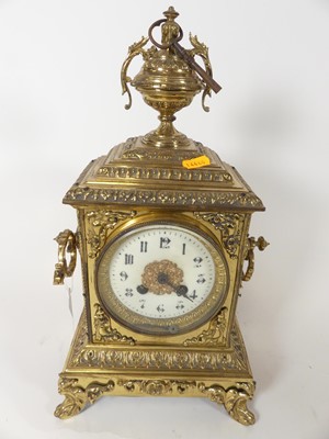 Lot 31 - An early 20th century brass cased mantel clock,...