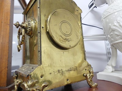 Lot 31 - An early 20th century brass cased mantel clock,...
