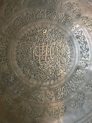 Lot 190 - An Indian brass charger, dia.55cm; together...
