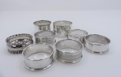 Lot 311a - A collection of silver napkin rings, gross...