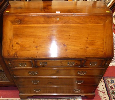 Lot 1184 - A contemporary yew slope front writing bureau,...