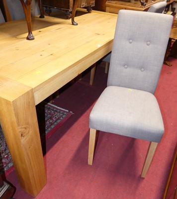 Lot 1252 - A contemporary blond oak rectangular dining...