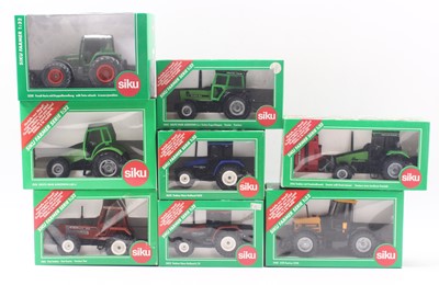 Lot 1832 - A collection of eight boxed Siku 1/32 scale...