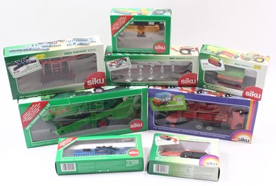 Lot 1833 - Eight various boxed Siku 1/32 scale farming...