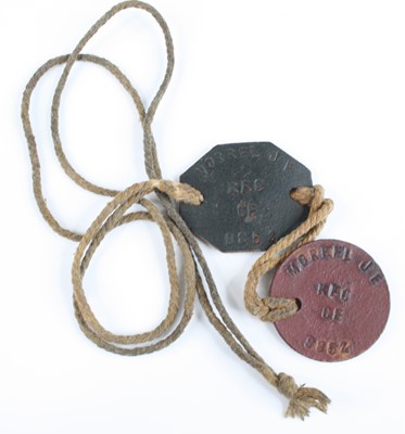 Lot 649 - A pair of WW I identity discs, naming J.E....