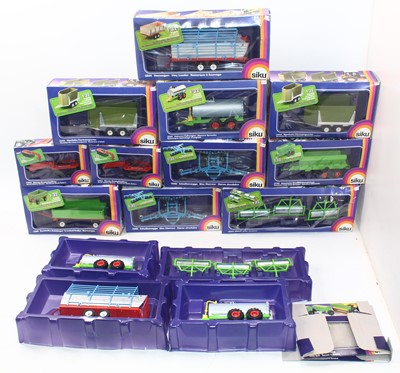 Lot 1839 - A collection of 14 boxed or part boxed Siku...