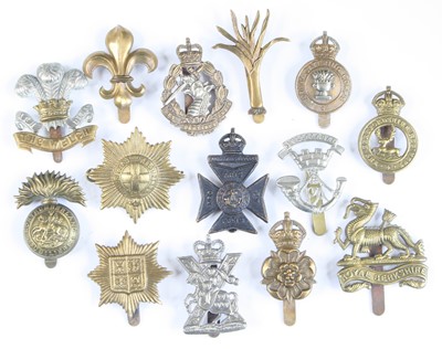 Lot 561 - A collection of assorted cap badges and...