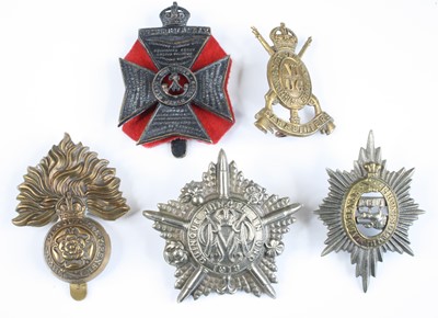 Lot 561 - A collection of assorted cap badges and...
