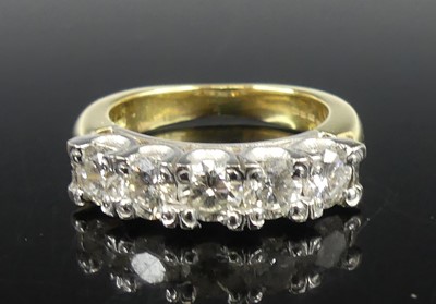 Lot 2245 - An 18ct yellow and white gold diamond half...