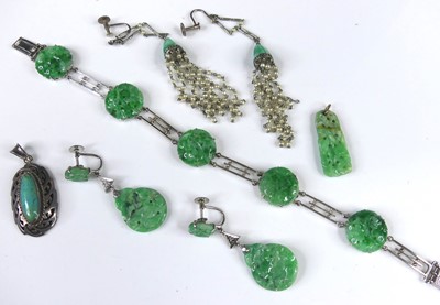 Lot 2264 - A 9ct white gold and jade bracelet, arranged...