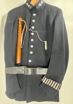 Lot 720 - A blue cloth high necked single breasted...