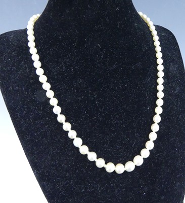Lot 2224 - A cultured pearl necklace, arranged as 67...