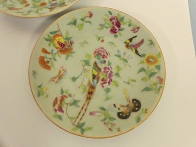 Lot 245 - Two Chinese celadon plates; together with two...