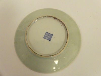 Lot 245 - Two Chinese celadon plates; together with two...