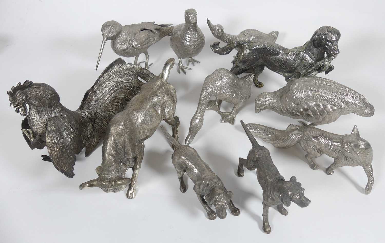 Lot 261 - A collection of silver coloured metal animals,...
