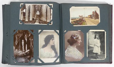 Lot 594 - An early 20th century postcard album and contents