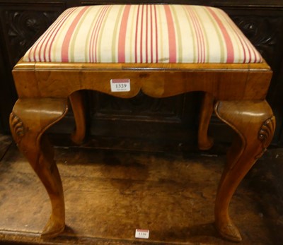 Lot 1329 - A walnut dressing stool in the early 18th...