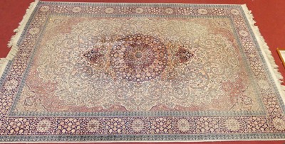 Lot 1162 - A Persian woollen Tabriz rug (faded), 280 x 186cm