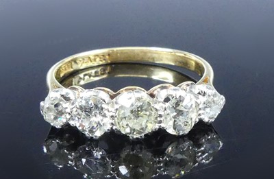 Lot 2539 - A yellow and white metal diamond half eternity...
