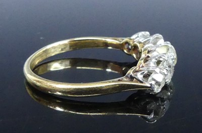 Lot 2539 - A yellow and white metal diamond half eternity...