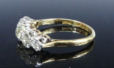 Lot 2539 - A yellow and white metal diamond half eternity...