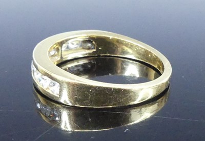 Lot 2549 - A yellow metal diamond half eternity ring,...