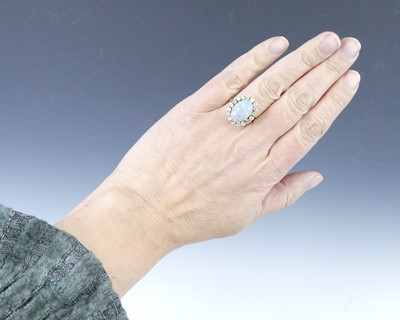 Lot 2501 - An 18ct yellow and white gold, opal and...