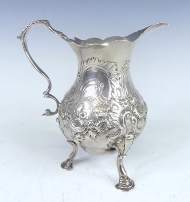 Lot 1089 - A George II silver cream jug, of lower bellied...